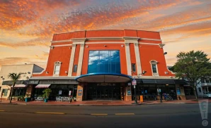 a photograph of the paramount theatre in huntington, new york, captured at sunset.