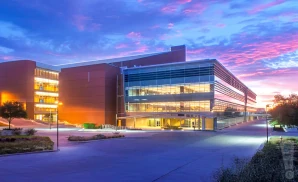 an exterior promotional venue picture of peoria civic center theater with a sunset sky