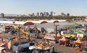 a professional promo picture of the adams county fair grounds at sunset with clouds. 