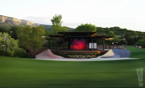 a promotional venue picture of the red butte garden amphitheater taken from inside the garden during sunset