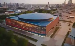 an exterior picture of the rocket mortgage fieldhouse from across the street during sunset