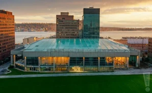 a photograph of the scotiabank centre in halifax, nova scotia, captured at sunset. 