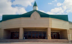 an exterior promotional venue picture of show place arena with a cloudy sky