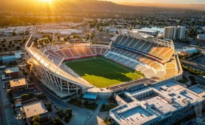 a hyper-realistic wide-angle aerial photograph of snapdragon stadium in san diego, california, captured at sunset. 