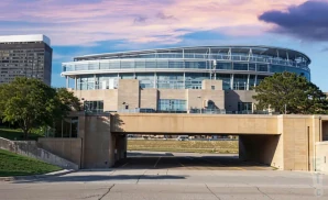 an exterior promotional venue picture of soldier field with a sunset sky
