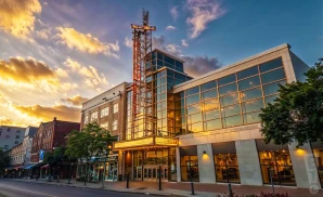 a photograph of stamford center for the arts – palace theatre in stamford, connecticut, captured at sunset. 