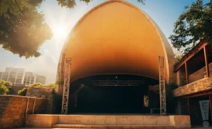 an exterior promotional venue picture of stubbs waller creek amphitheater with a sunset sky