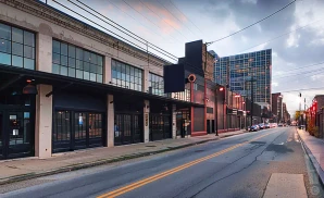 an exterior promotional venue picture of the factory in deep ellum with a sunset sky