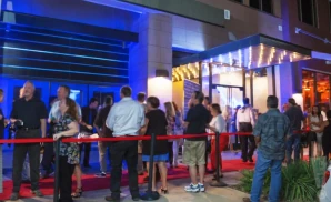 an exterior promotional venue picture of the plano house of comedy during a cloudy day 