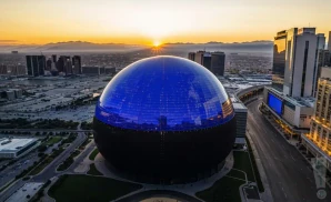 a drone photograph of the exterior of the sphere in las vegas, nevada during sunset.