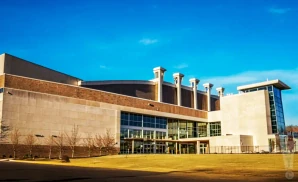 exterior promotional venue picture of tyson events center fleet farm arena with a sunny sky