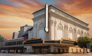 a photograph of the united palace theatre in new york city, captured at sunset. 