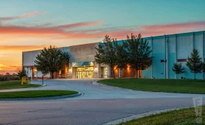 a cinematic ultra-realistic photograph of the viaero event center in kearney, nebraska, captured at sunset.