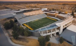 a realistic drone promo venue photograph of the war memorial stadium wy at sunset with clouds.