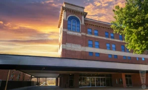 an exterior promotional venue picture of williamsport community arts center with a sunset sky