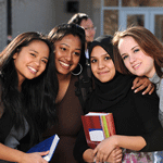 A diverse group of students uniting and smiling together.