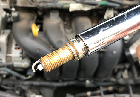 inspecting a spark plug