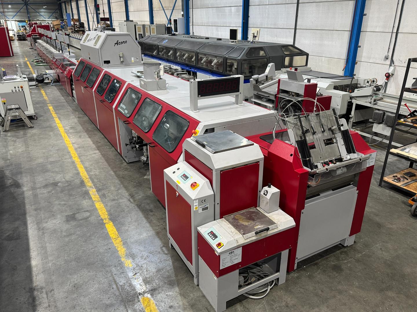 2007 - Muller Martini Acoro A7 perfect binder with inline gatherer and three knife trimmer