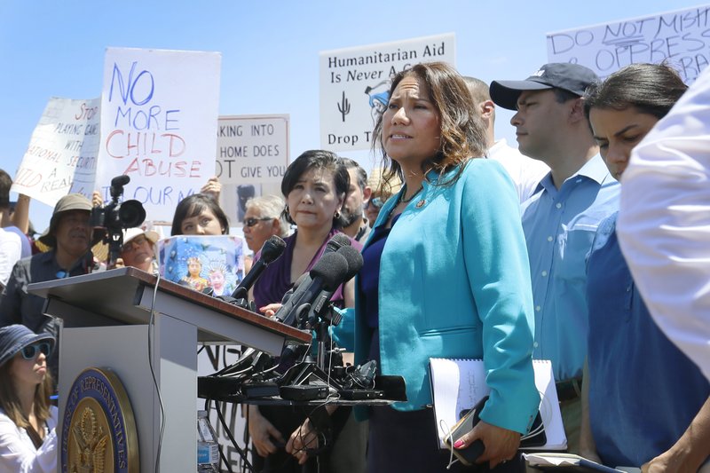 U.S. Rep. Veronica Escobar, D-El Paso, member of the House Judiciary Committee and Freshman Representative of the Hispanic Caucus talks about what she saw on her tour of area border facilities Monday, July 1, 2019, at the Border Patrol station in Clint. Escobar was attempting to talk over the protesters. (Briana Sanchez / El Paso Times via AP) AP Explains How Facebook handles speech in 'secret' groups | FACTSWANTED