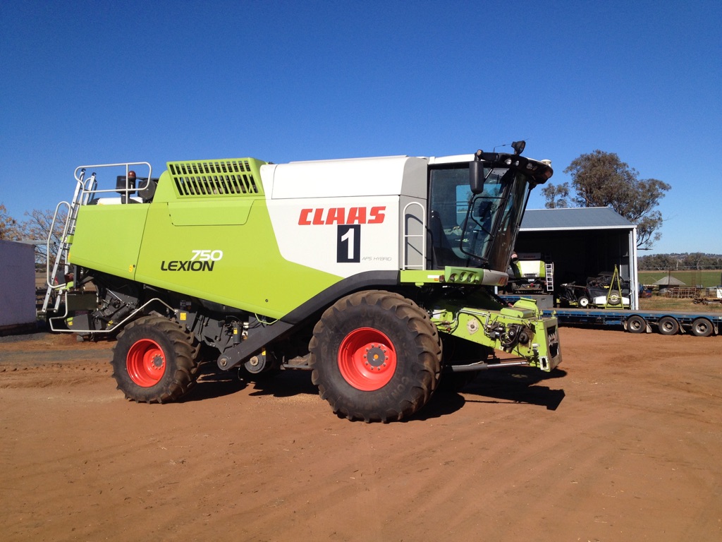 Claas 750 header with 40ft Macdon Draper front " Price