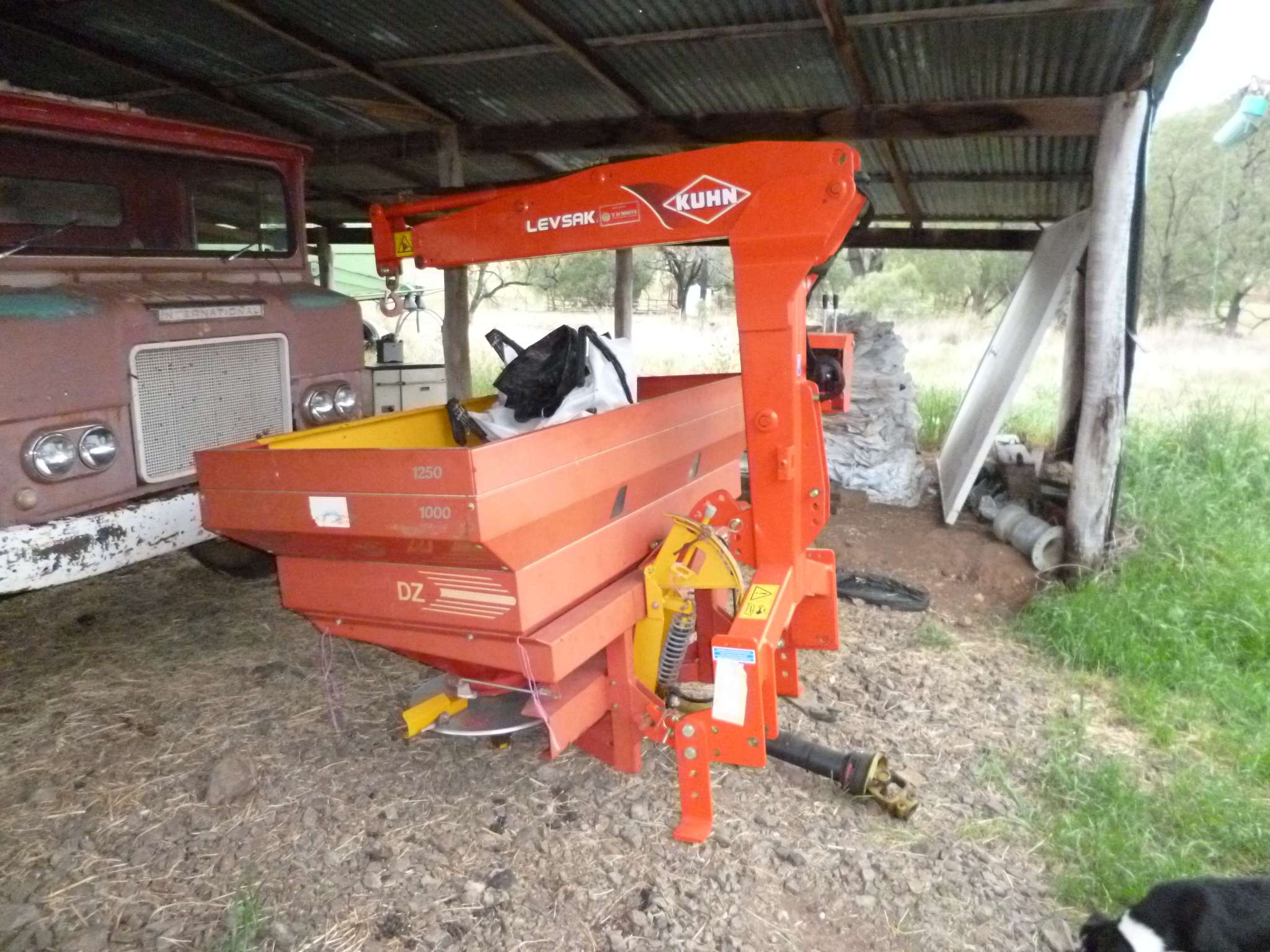 Fertilizer spreader with self fill bag hoist Machinery
