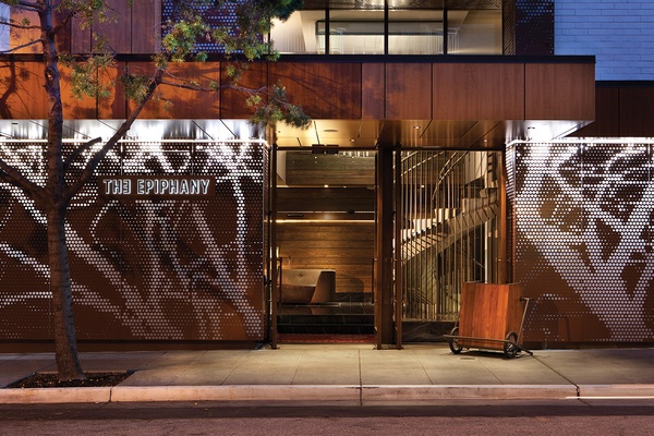The exterior of The Epiphany hotel at dusk.