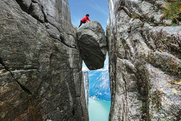 Atop the Kjeragbolten boulder in Norway