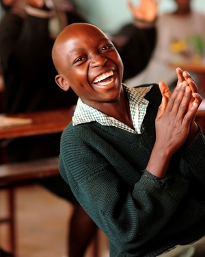 Boy laughing in class
