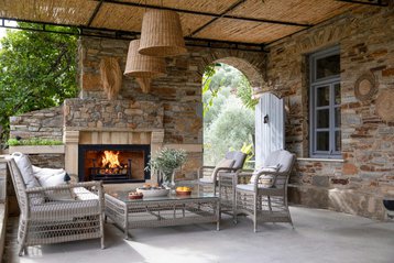 Outdoor fireplace and seating at Kairos Farmhouse