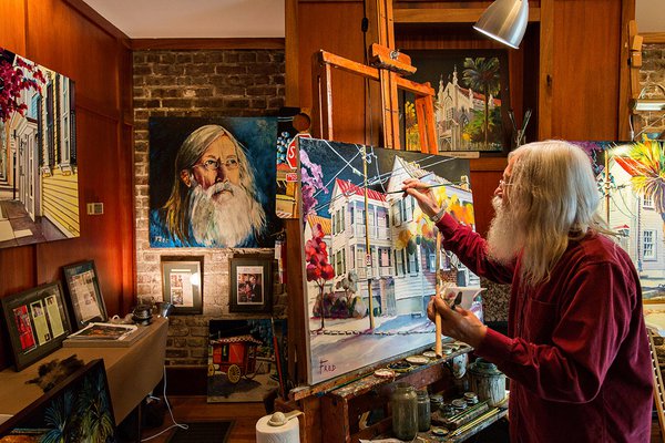 An artist paints at The Vendue.