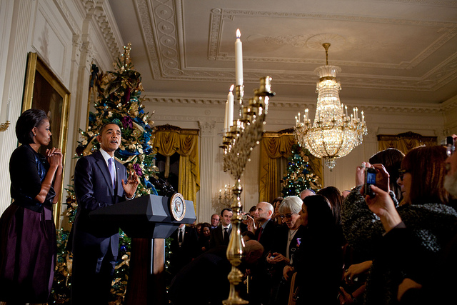 President Barack Obama and First Lady Michelle Obama take part in the Hanukkah candle lighting ceremony in the East Room of the White House, Dec. 2, 2010. (Photo Pete Souza/White House) 2012_12_obamahanukkah
