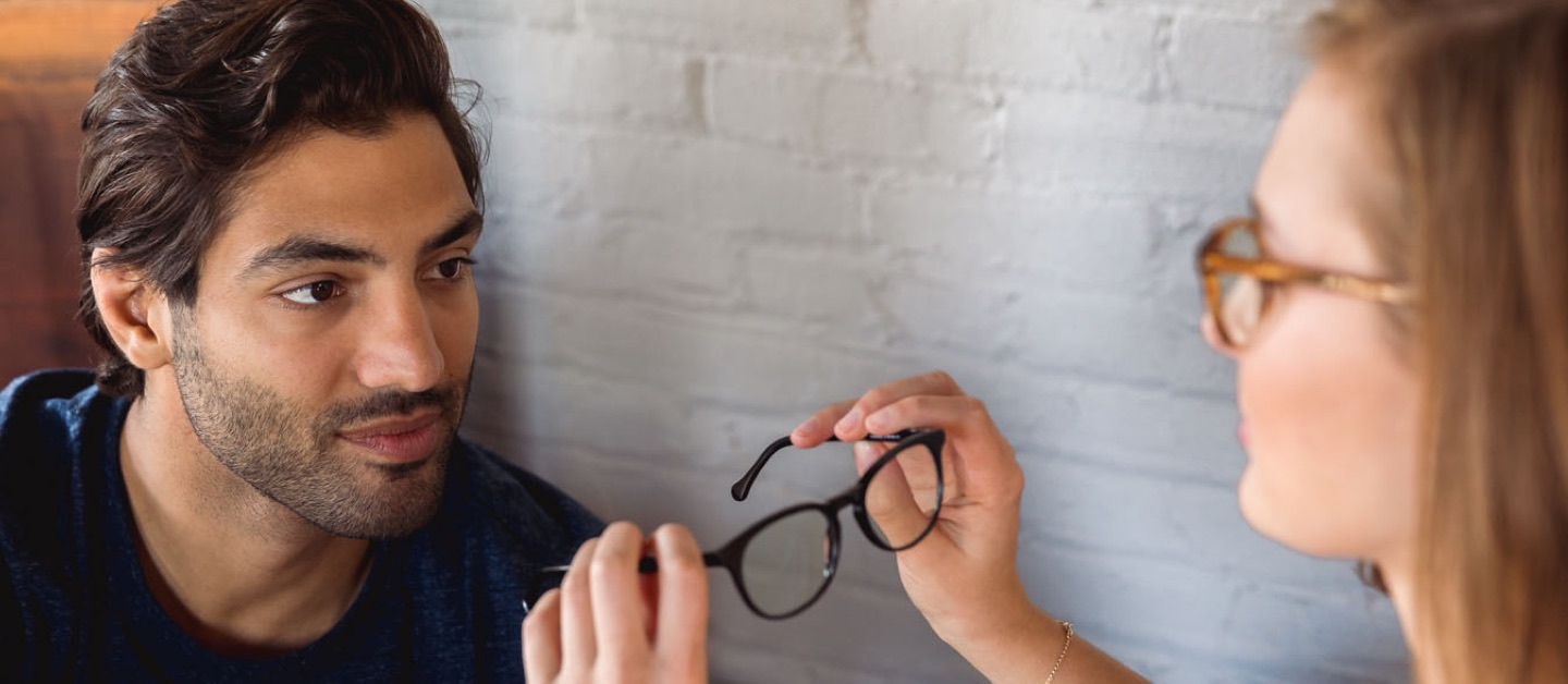 Man and Women trying on glasses