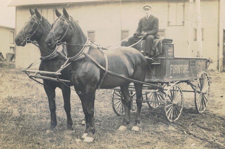 Vern Halteman on the first furniture delivery wagon.