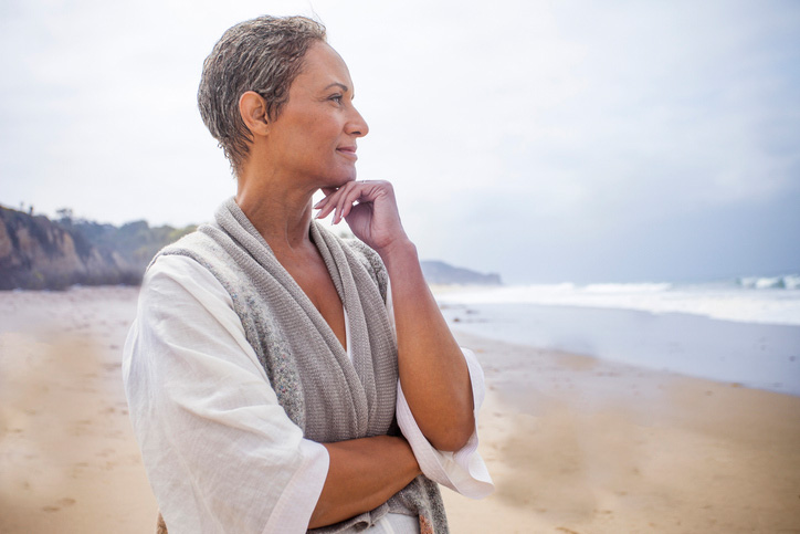 woman on beach considering preplanning funeral needs