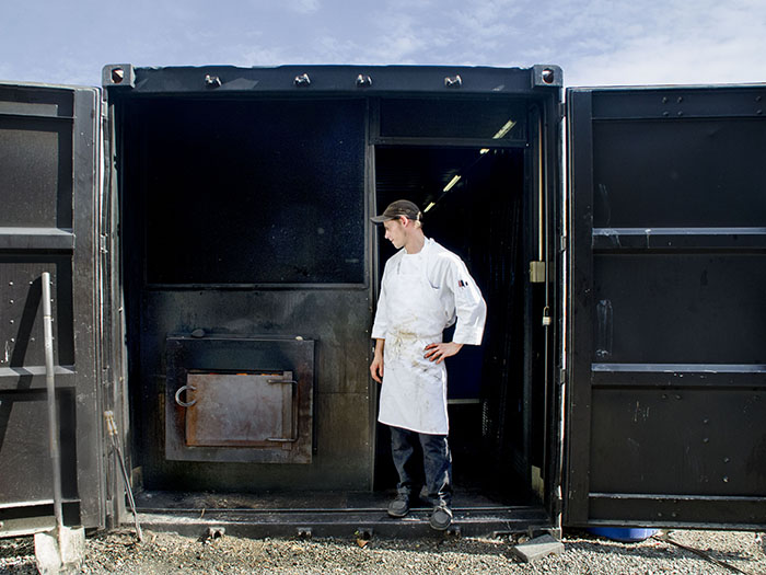 Pitmaster Joe minds Delaney BBQ's outdoor water-tank-turned-smoker.