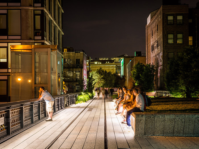 Visitors relax on the High Line at 23rd Street. Photo by Mike Tschappat