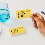The Lasting Impact of Traditional Business Cards and Directional Signs in a Digital Age