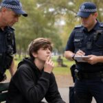 What happens if an Underage Boy is found smoking a cigarette in Australia?