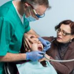 When is oral surgery required for wisdom tooth removal?