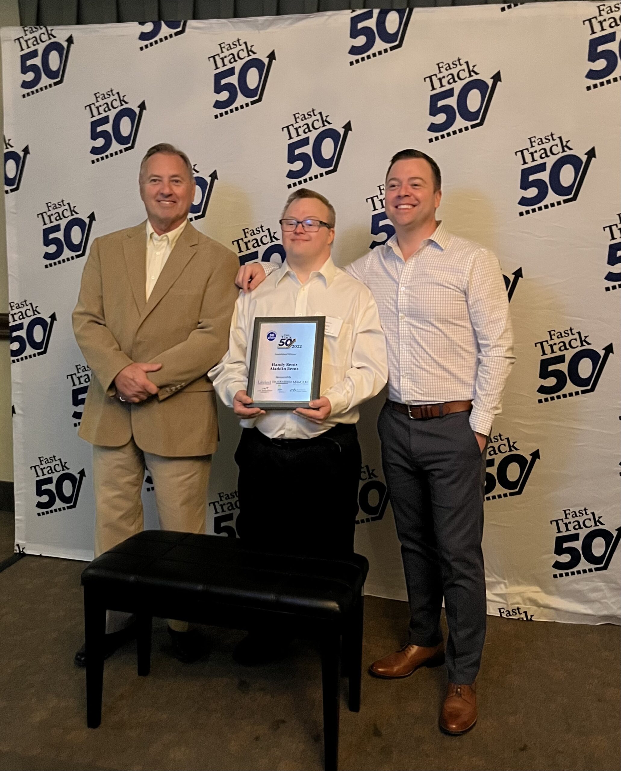 Mike, Christopher and Patrick receiving the Fast Track 50 award
