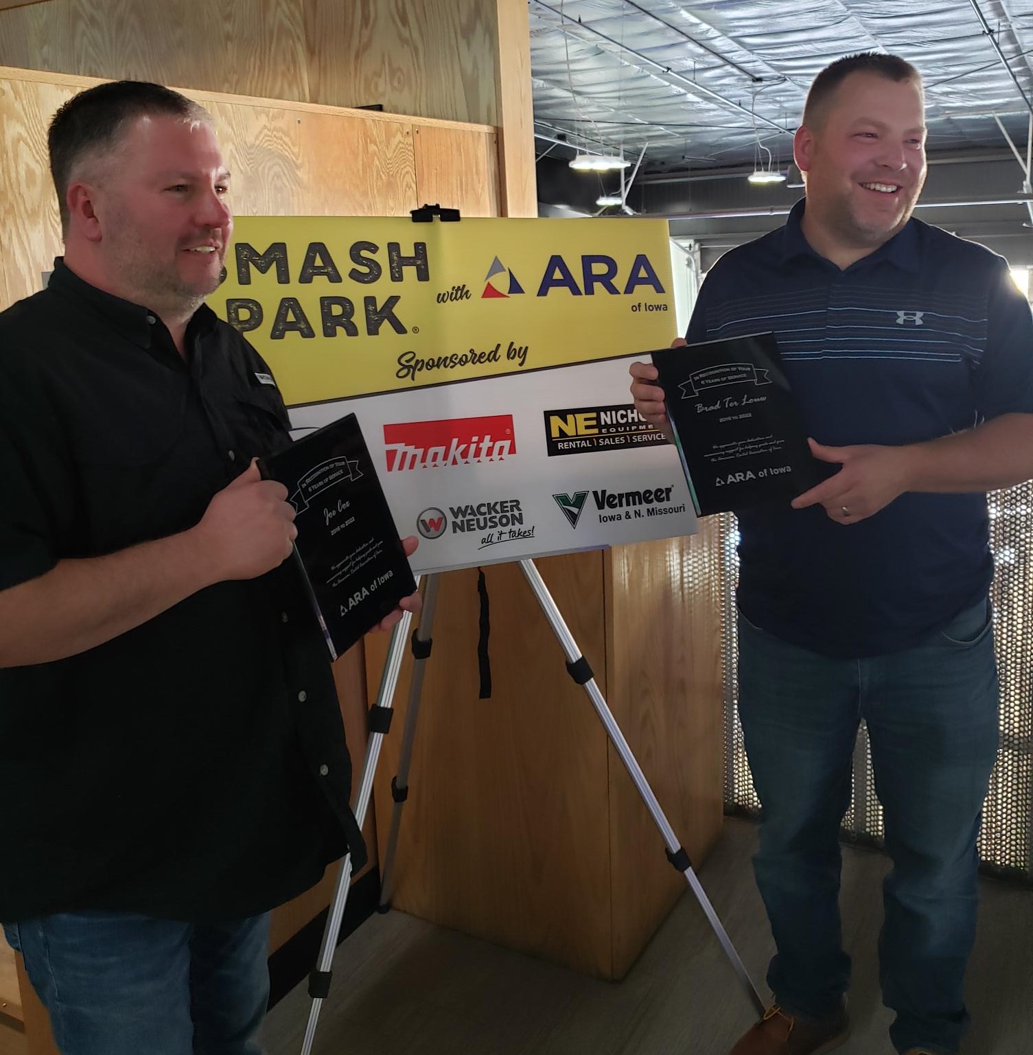 Past ARA of Iowa board members Joe Cox, left, and Brad Terlouw receive plaques recognizing their service.