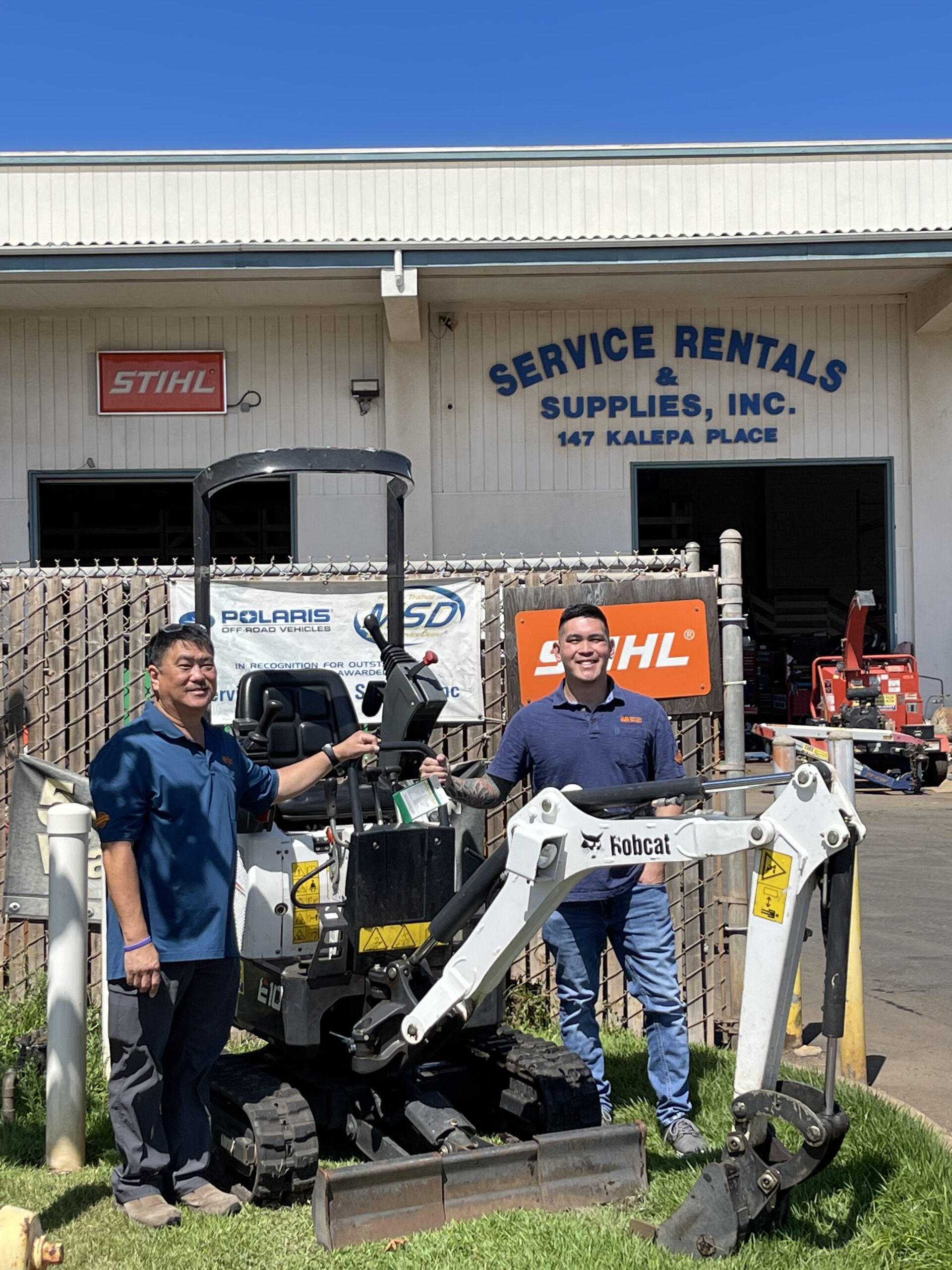 Ryan Ouye, left, and his son, Rysan, in front of the main location of Service Rentals & Supplies
