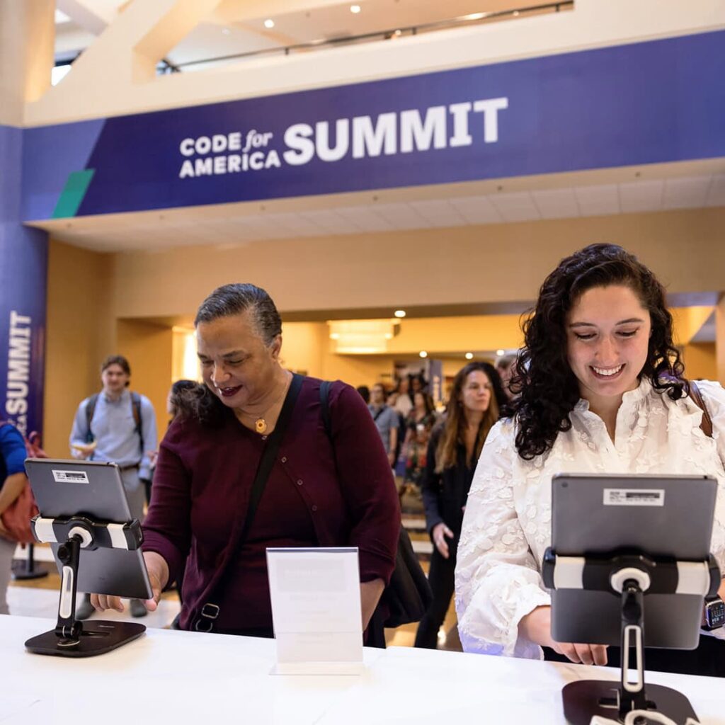 Attendees at the registration desk at Code for America Summit