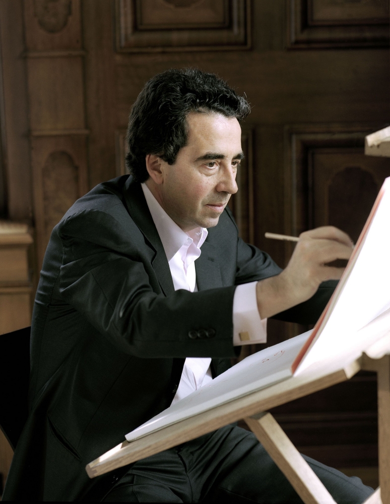 Color photographic portrait of Santiago Calatrava sketching
