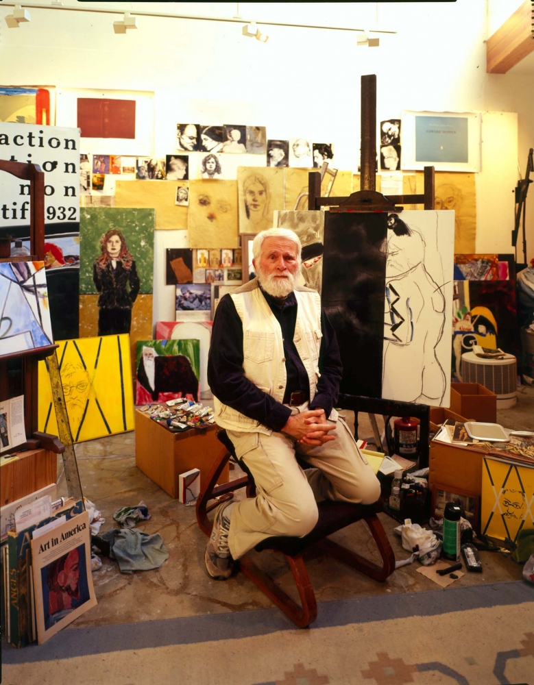 Color photographic portrait of R.B. Kitaj in his Studio surrounded by paintings