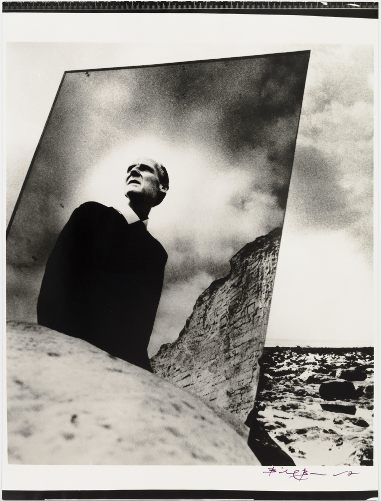 Black and white photographic portrait of Bill Brandt with mirror in nature