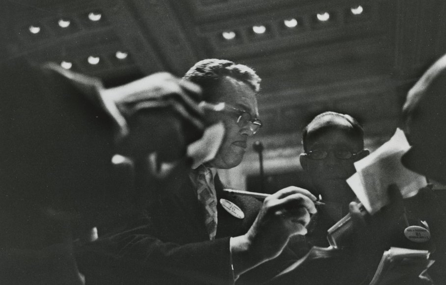 Traders in New York Stock Exchange Pit, 1957 Gelatin silver print; printed later, Howard greenberg gallery, 2020