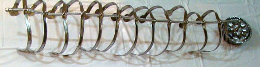 Adeela Suleman Lie Alone I, 2009 Bathroom pipes, steel tongs, slectroplated steamers, nuts and bolts 61h x 11.50w x 8.50d in