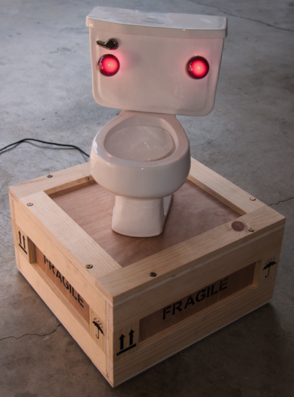Untitled Cast ceramic toilet, permanently sealed wood crate (contents: Vintage artwork by Jon Pylypchuk with packaging), light bulbs, wiring and hardware.