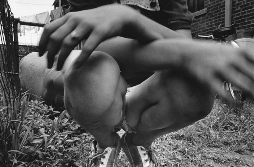  Youth Crouching, 1974, 	16 x 20 inch gelatin silver print